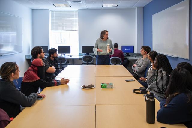 Biology students are pictured with Dr. Wendy Clement, before TCNJ alumnus Dr. Christian Mirescu speaks about next-generation therapeutic strategies to neurodegenerative disease modification in the newly renovated Biology Lounge. Dr. Mirescu is a Senior Vice President at Vigil Neuroscience in Boston. March 28, 2025.