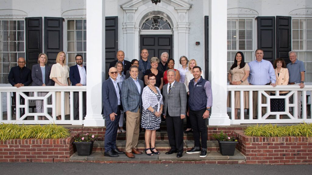Members of the board smiling and posing as a group.